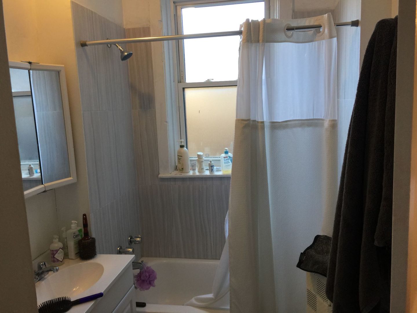 638 West Roscoe Street, Unit 3 Chicago, IL 60657 - Photo 12 of 13 a bathroom with a sink and a shower