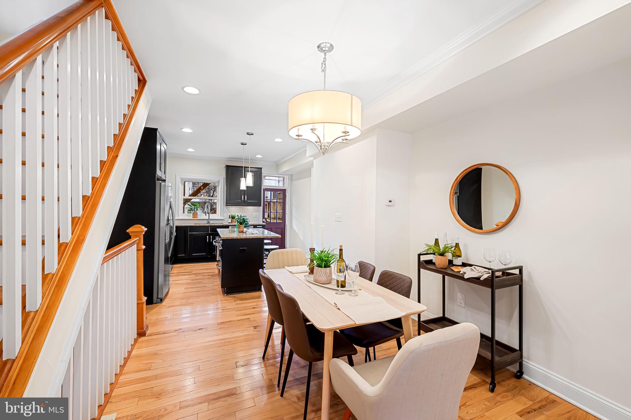 116 Rochester Place Baltimore, MD 21224 - Photo 11 of 45 a view of a dining room with furniture and wooden floor