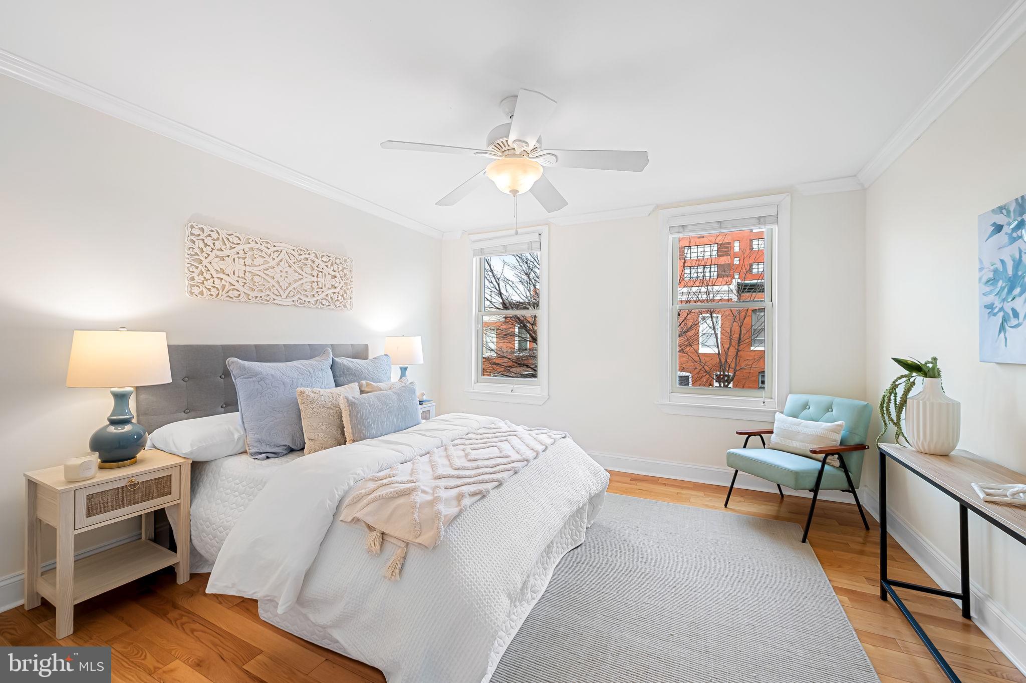 116 Rochester Place Baltimore, MD 21224 - Photo 20 of 45 a bedroom with a bed and a chandelier