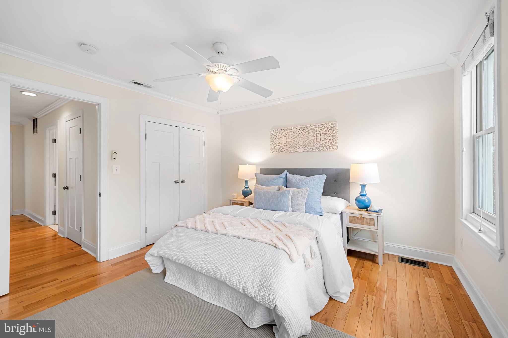 116 Rochester Place Baltimore, MD 21224 - Photo 22 of 45 a bedroom with a bed and wooden floor