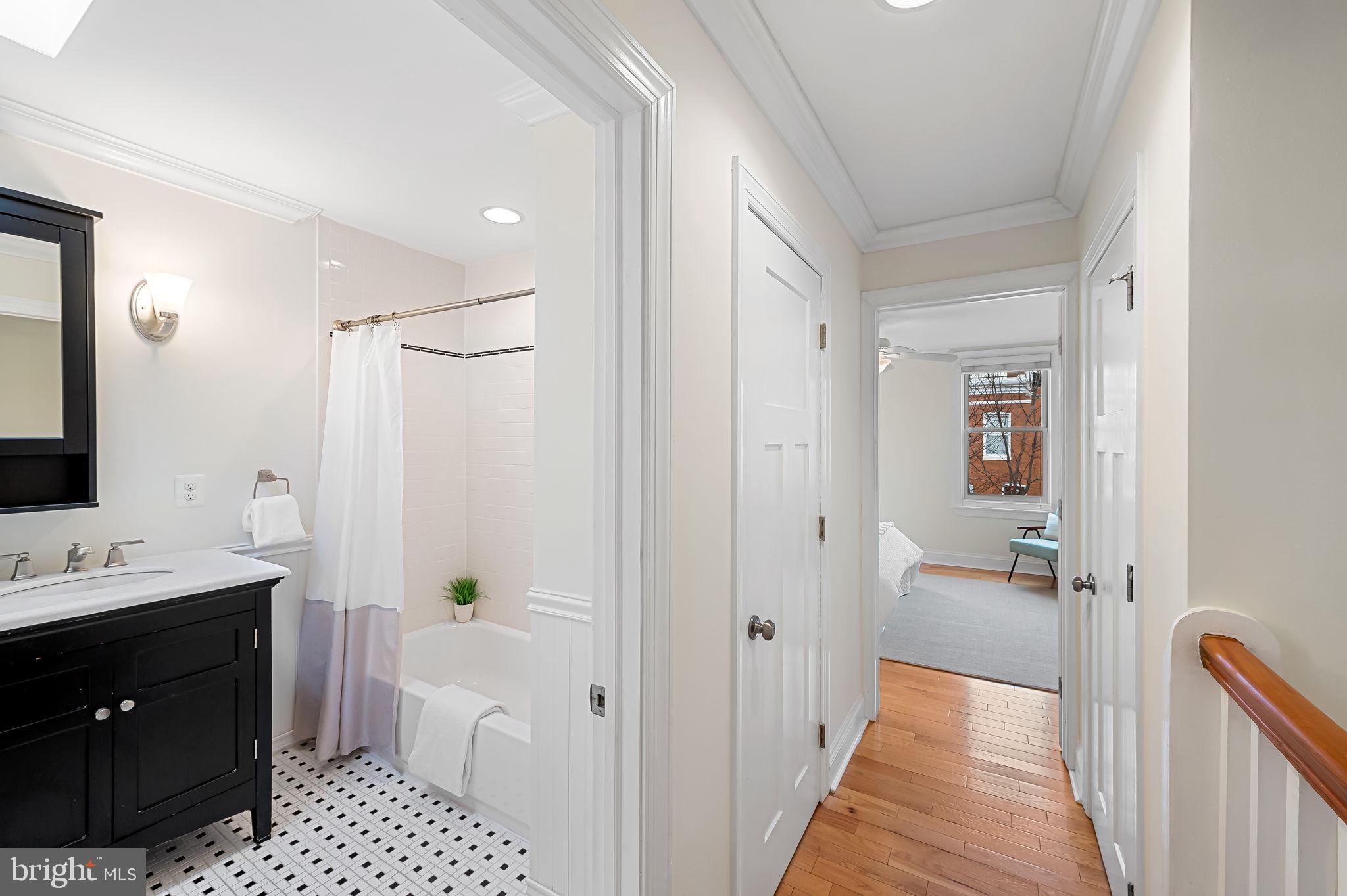 116 Rochester Place Baltimore, MD 21224 - Photo 23 of 45 a bathroom with a sink a toilet and shower