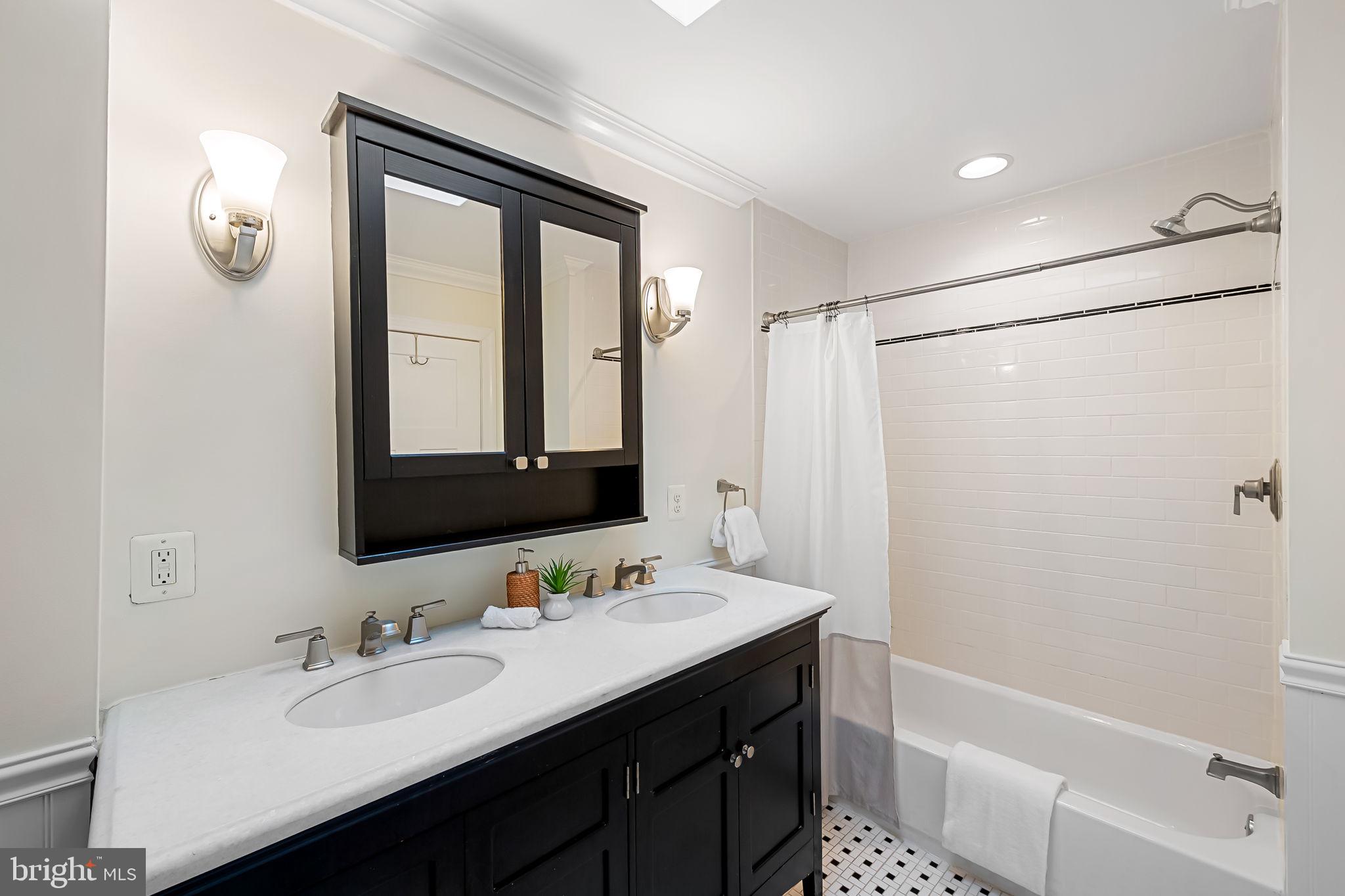 116 Rochester Place Baltimore, MD 21224 - Photo 24 of 45 a bathroom with a double vanity sink mirror and double