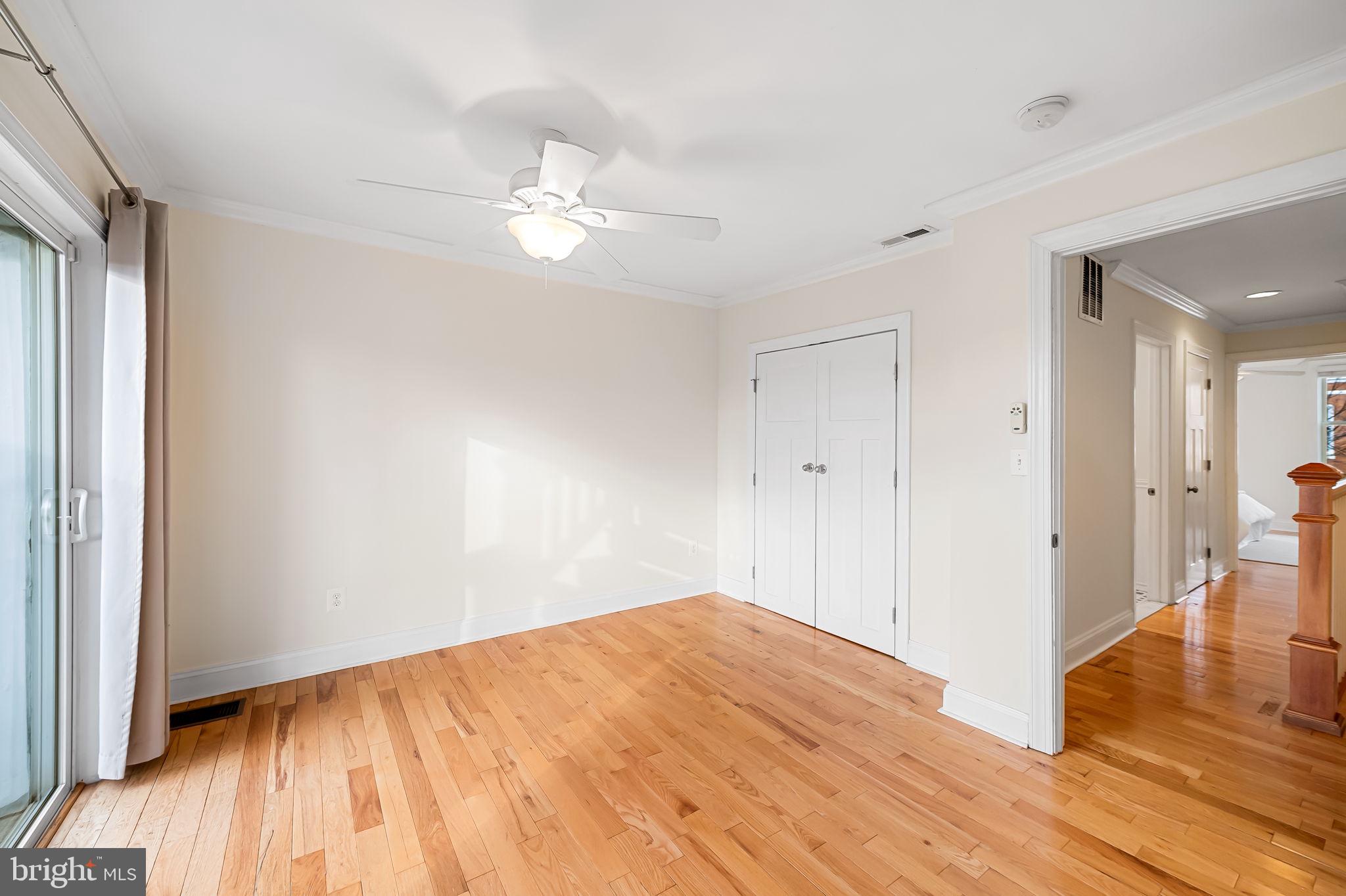 116 Rochester Place Baltimore, MD 21224 - Photo 25 of 45 a view of empty room with wooden floor
