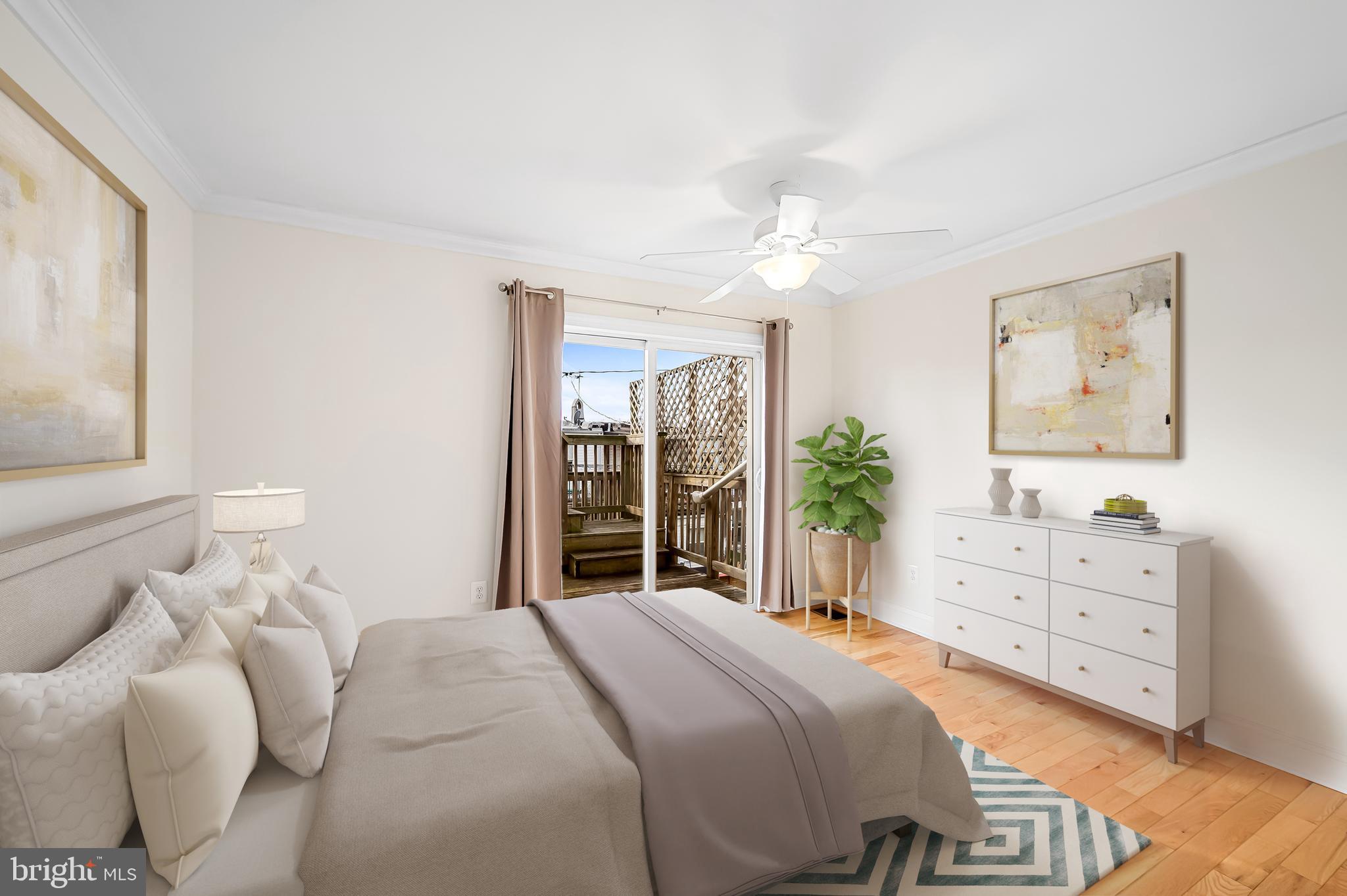 116 Rochester Place Baltimore, MD 21224 - Photo 26 of 45 a bedroom with a bed and a chandelier