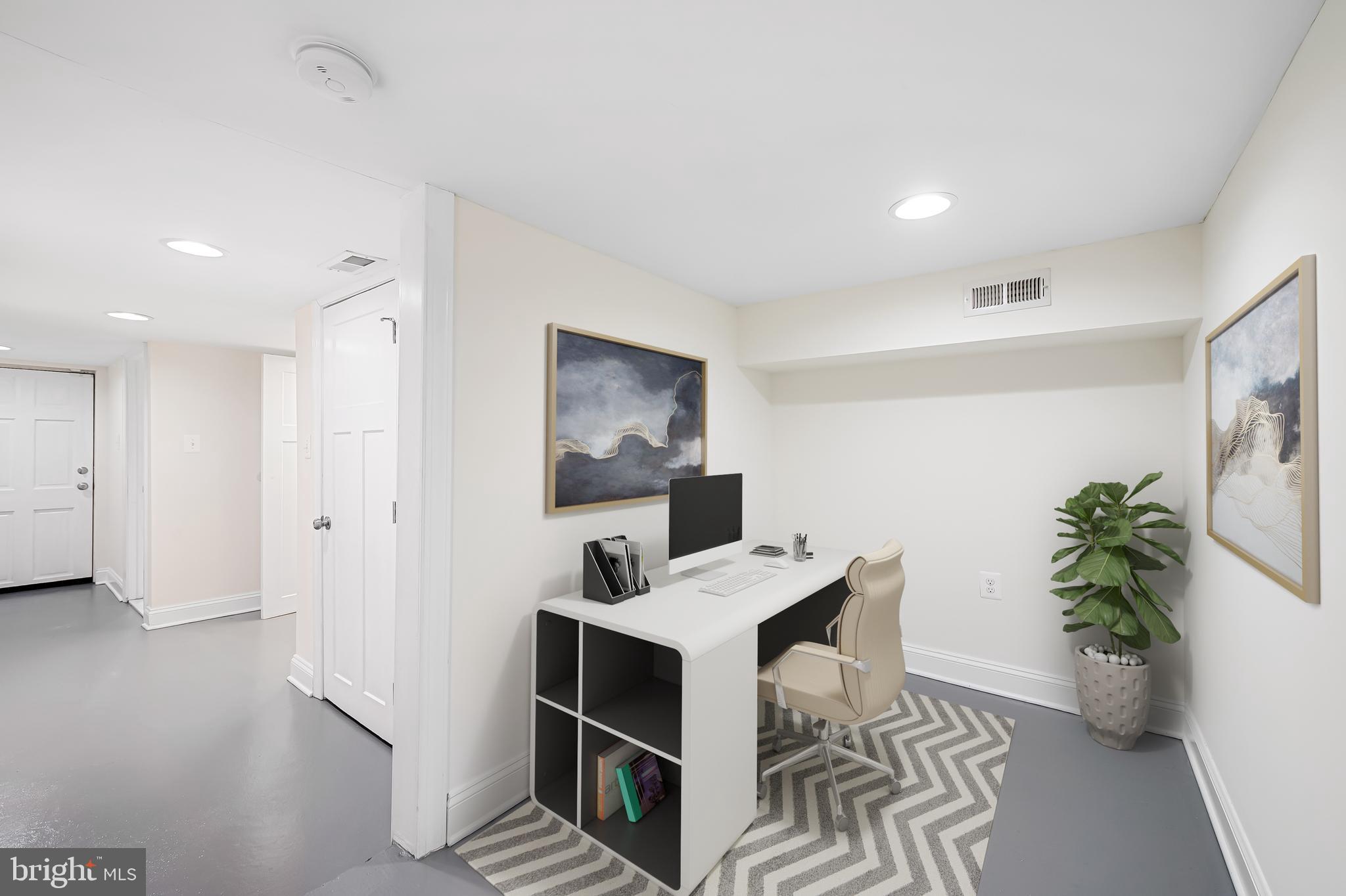 116 Rochester Place Baltimore, MD 21224 - Photo 39 of 45 a workspace with furniture and white walls