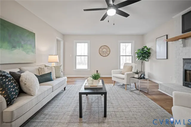 a dining room with furniture a rug and a window
