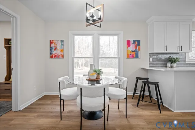 a kitchen with stainless steel appliances granite countertop a refrigerator stove and sink