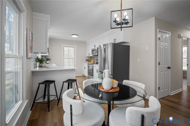 a dining room with furniture and window