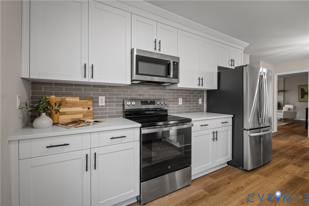 15101 Loving Union Road Disputanta, VA 23842 - Photo 22 of 50 a kitchen with stainless steel appliances granite countertop a refrigerator stove and sink
