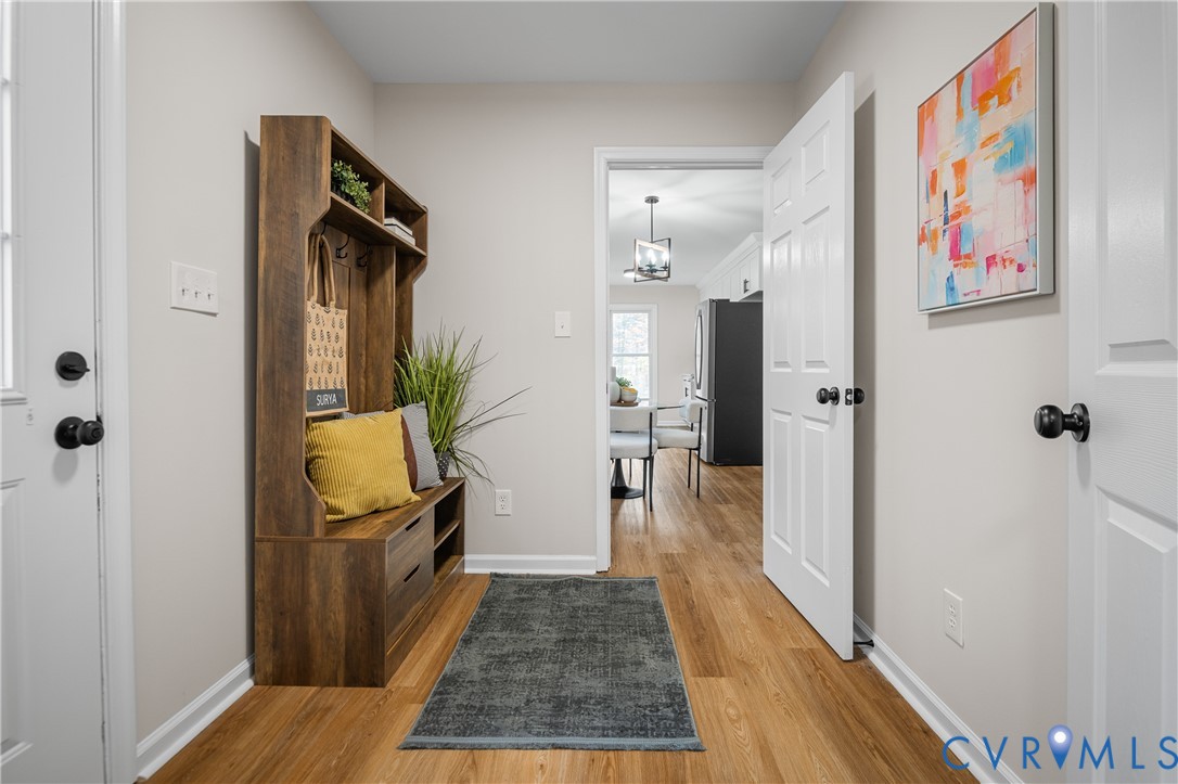 15101 Loving Union Road Disputanta, VA 23842 - Photo 25 of 50 a view of a hallway view with wooden floor and staircase