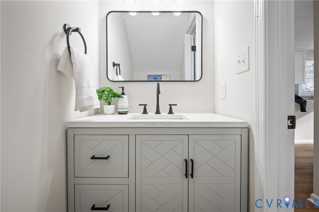 15101 Loving Union Road Disputanta, VA 23842 - Photo 29 of 50 a bathroom with a sink vanity and mirror