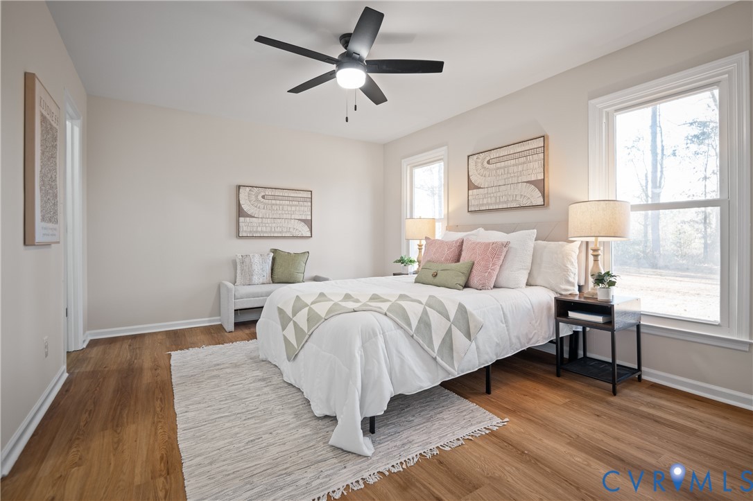 15101 Loving Union Road Disputanta, VA 23842 - Photo 30 of 50 a bedroom with a large bed and a window