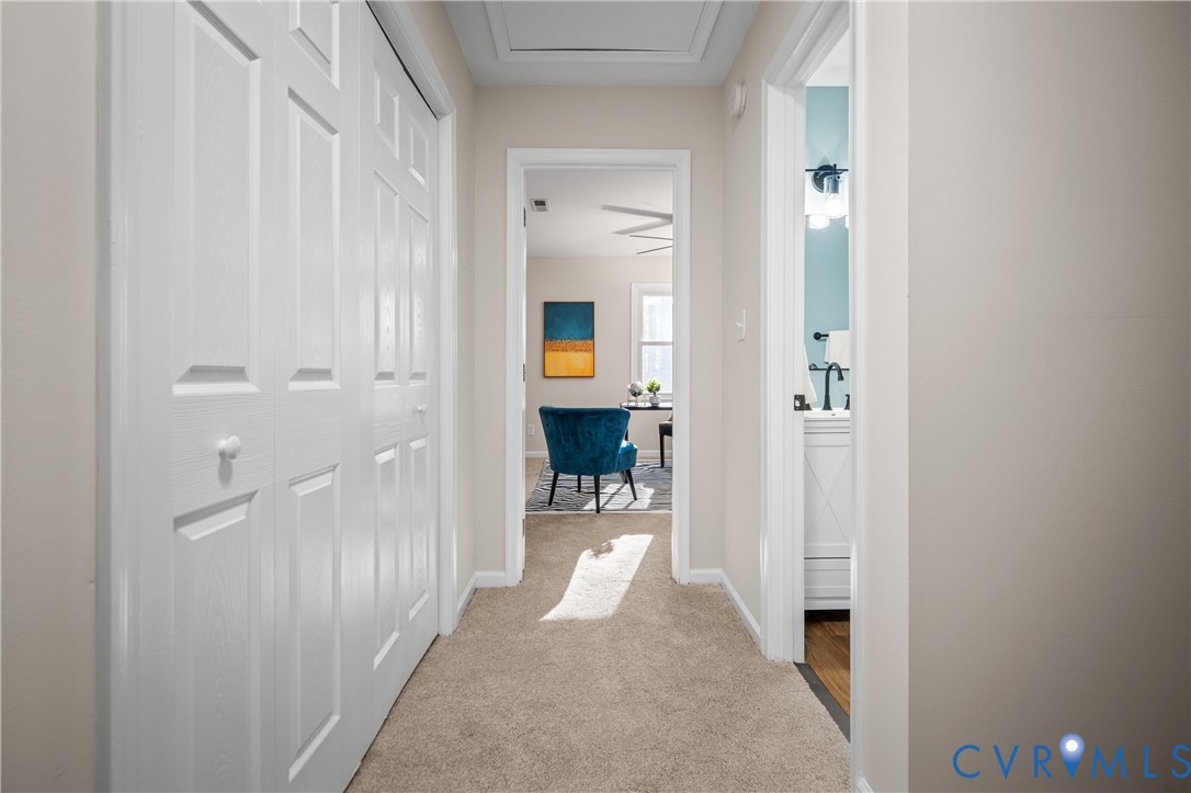 15101 Loving Union Road Disputanta, VA 23842 - Photo 34 of 50 a view of a hallway with wooden floor and staircase