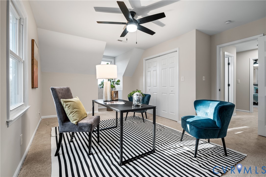 15101 Loving Union Road Disputanta, VA 23842 - Photo 37 of 50 a living room with furniture a rug and a chandelier