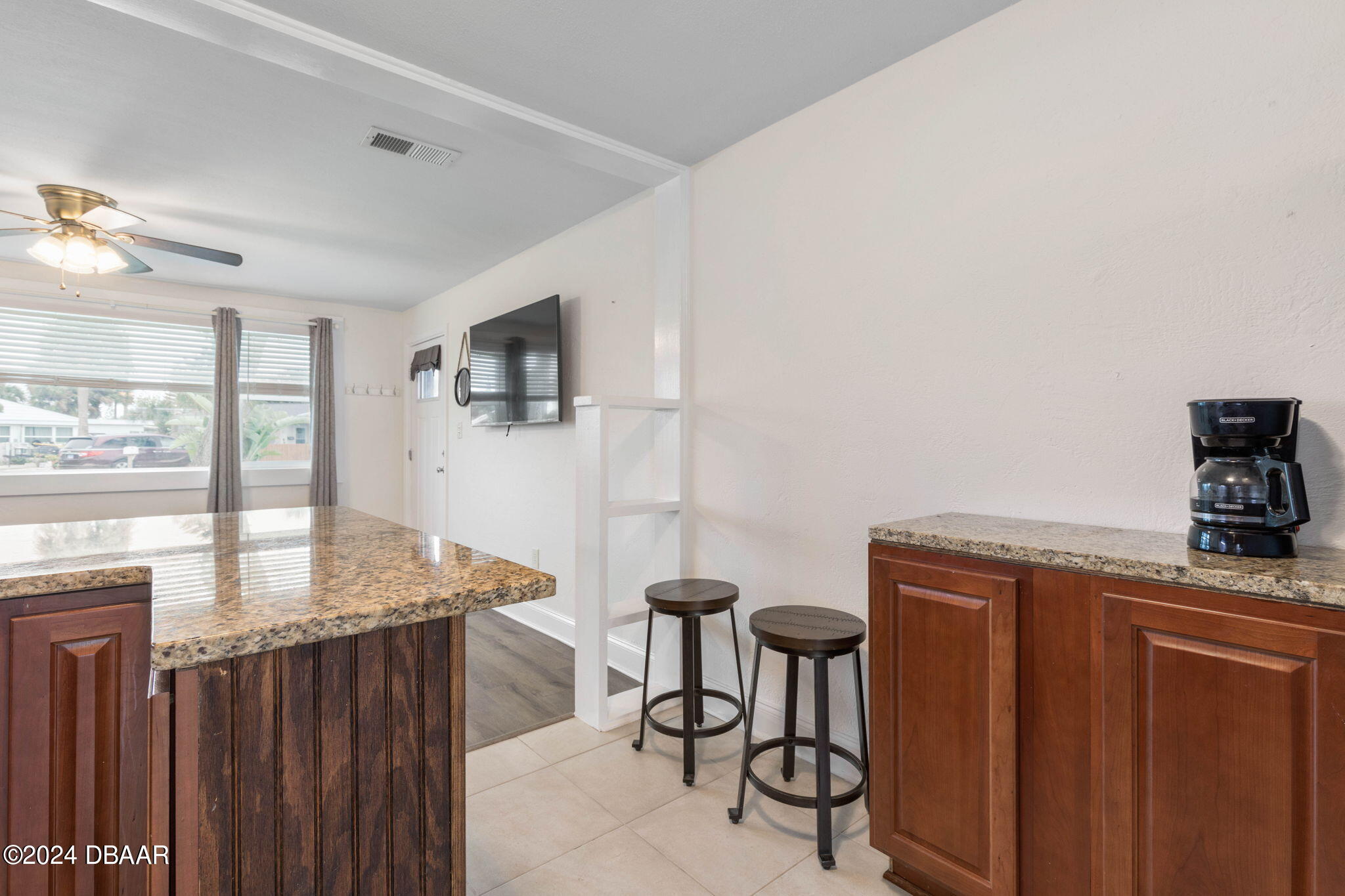 9 Palm Drive Ormond Beach, FL 32176 - Photo 14 of 47 a view of a dining room with furniture and a window