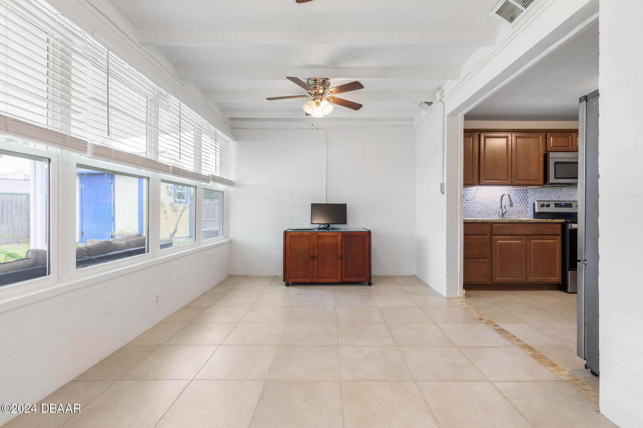 9 Palm Drive Ormond Beach, FL 32176 - Photo 18 of 47 a living room with furniture and a ceiling fan