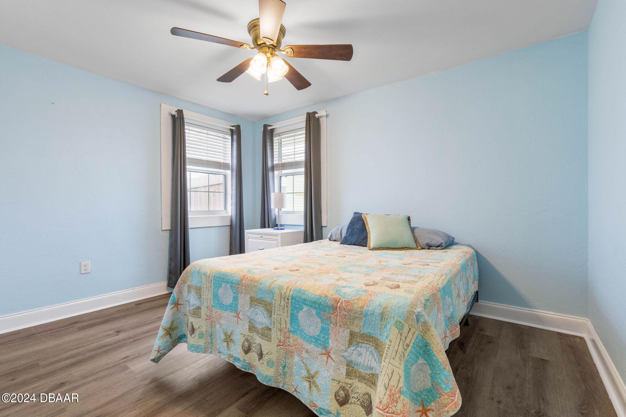 9 Palm Drive Ormond Beach, FL 32176 - Photo 20 of 47 a bedroom with a bed and a chandelier