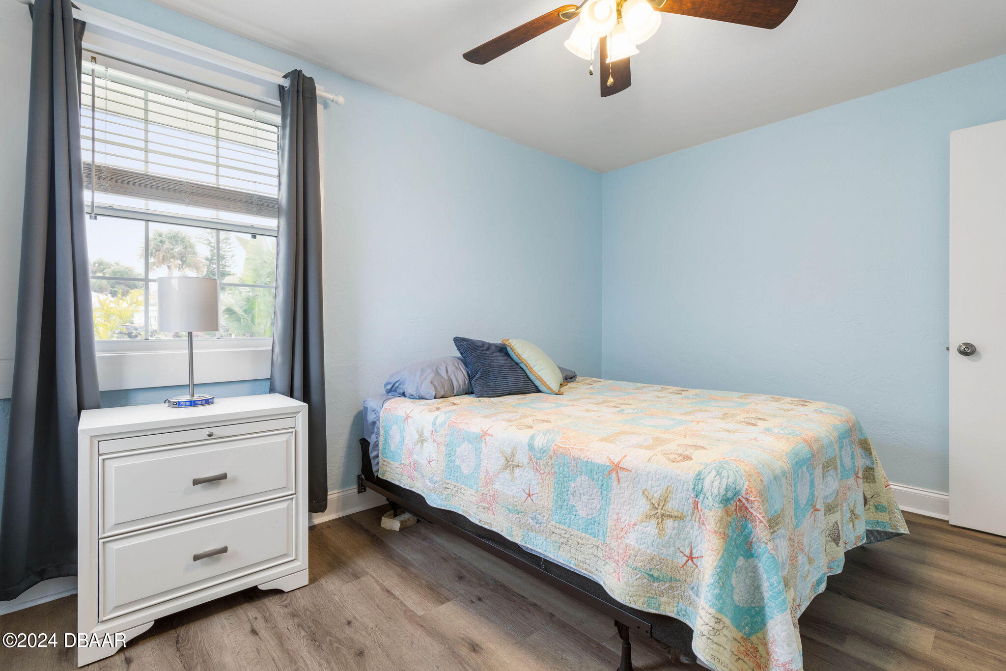 9 Palm Drive Ormond Beach, FL 32176 - Photo 21 of 47 a bedroom with a bed and a window
