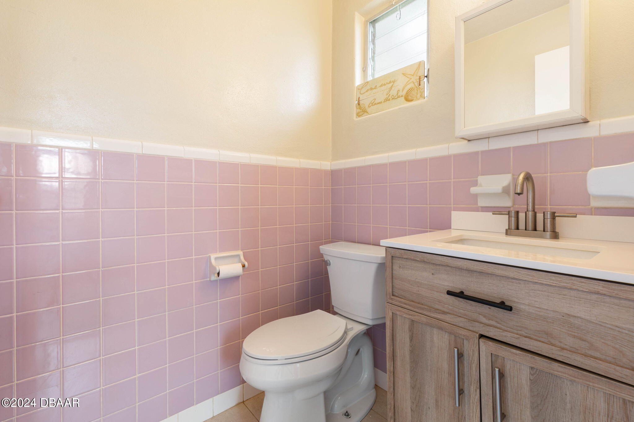 9 Palm Drive Ormond Beach, FL 32176 - Photo 31 of 47 a bathroom with a sink toilet and a mirror