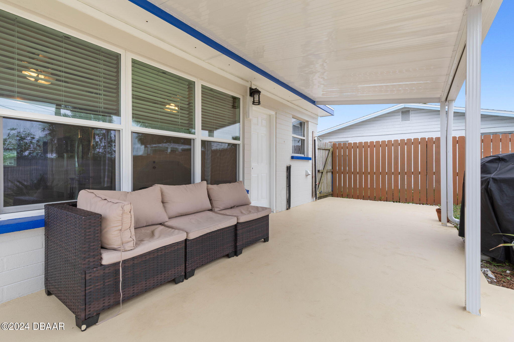 9 Palm Drive Ormond Beach, FL 32176 - Photo 32 of 47 a balcony with furniture and a ceiling fan