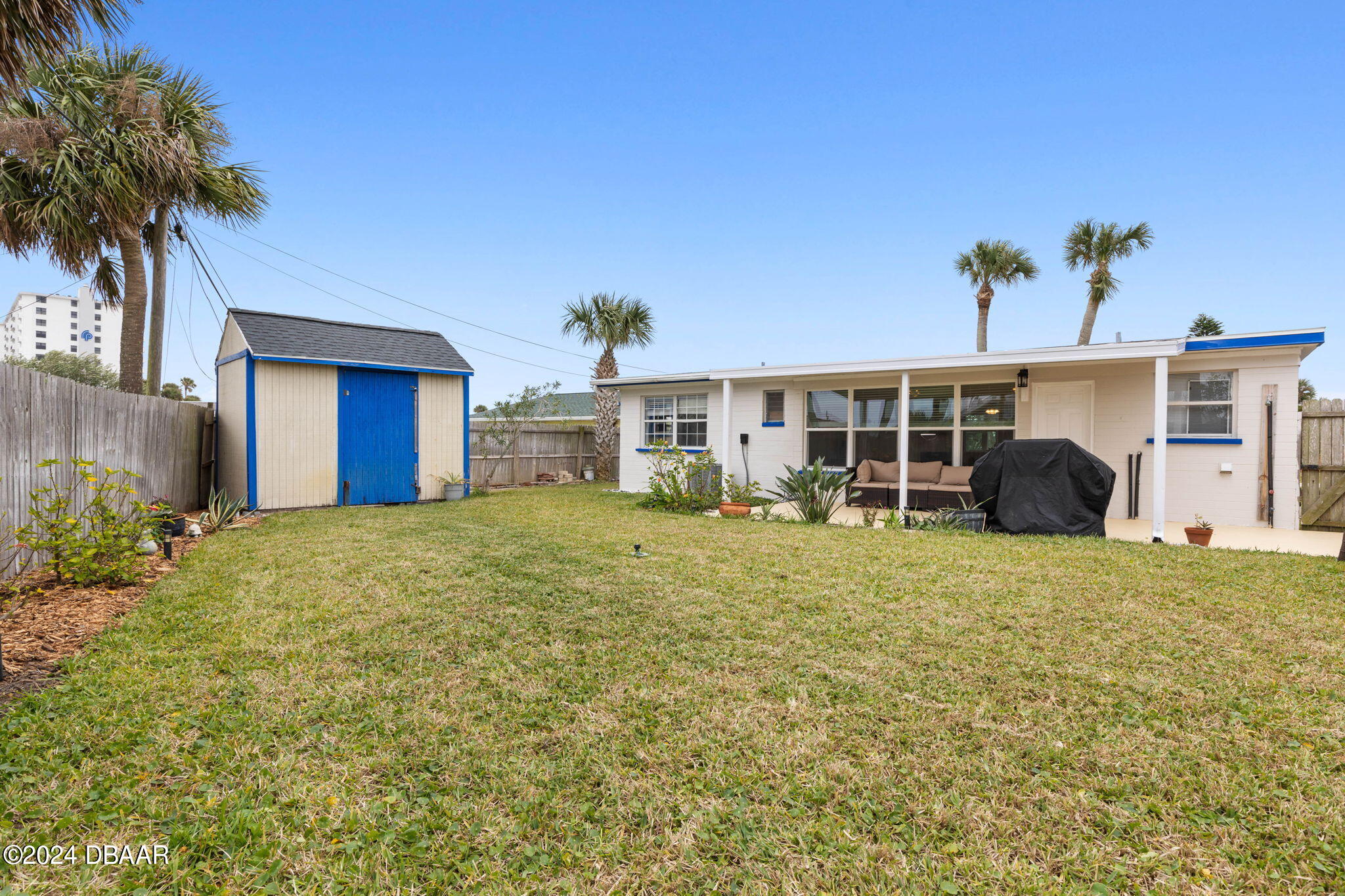 9 Palm Drive Ormond Beach, FL 32176 - Photo 34 of 47 a view of a house with a yard and potted plants