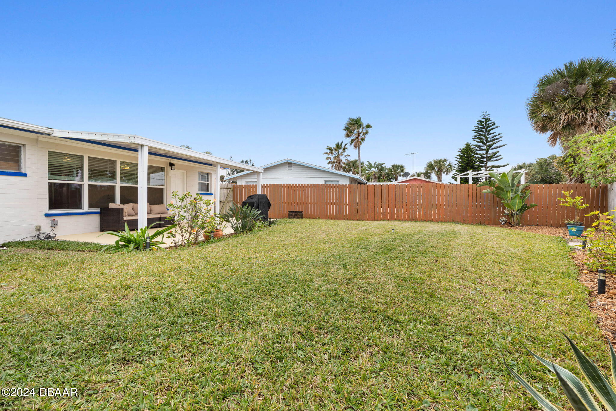 9 Palm Drive Ormond Beach, FL 32176 - Photo 35 of 47 front view of a house with a yard