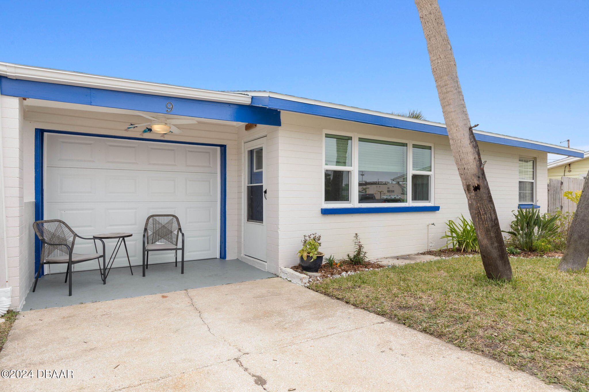9 Palm Drive Ormond Beach, FL 32176 - Photo 40 of 47 a front view of a house with garden