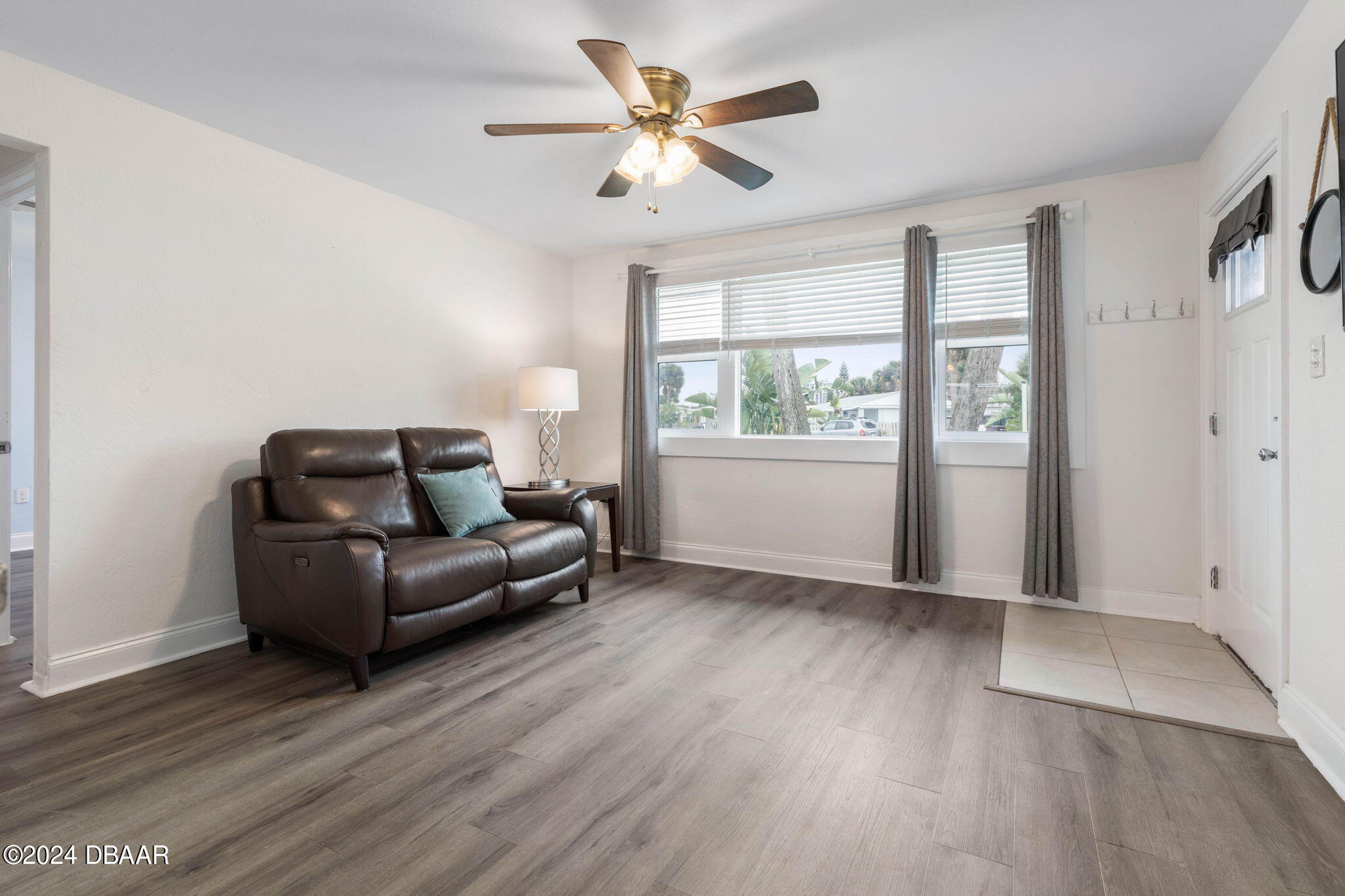9 Palm Drive Ormond Beach, FL 32176 - Photo 7 of 47 a living room with furniture and a large window