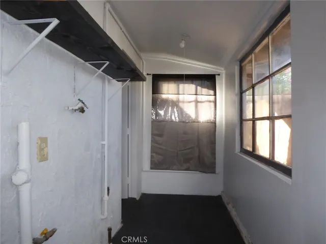 a view of hallway with windows