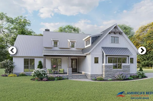 a front view of a house with a garden and plants