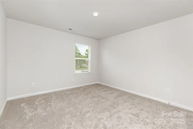 an empty room with closet area