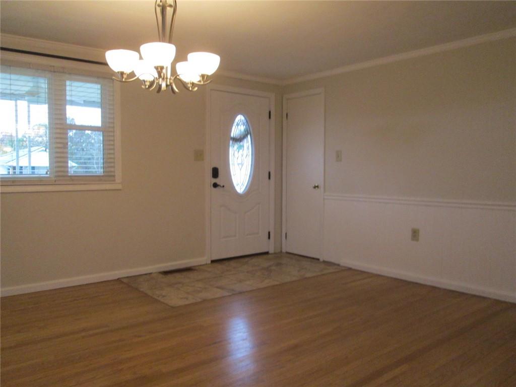 1778 Freeport Road Kittanning, PA 16201 - Photo 7 of 18 an empty room with wooden floor and windows