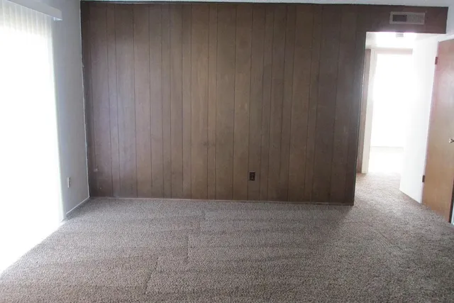 a kitchen with a sink a stove and cabinets