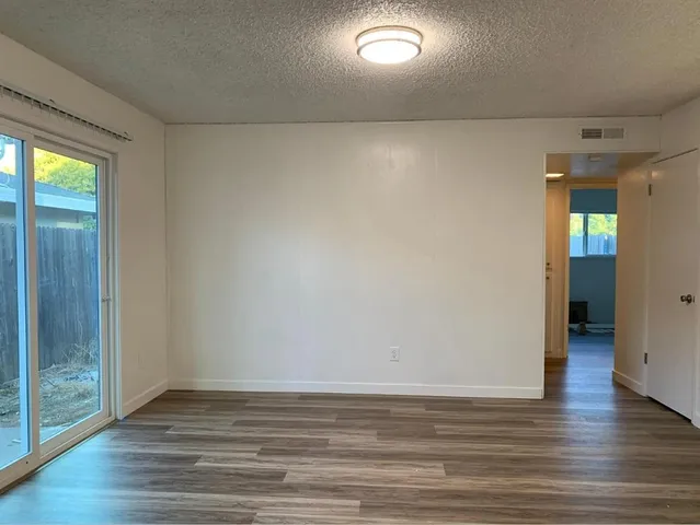 a view of wooden floor and brick walls
