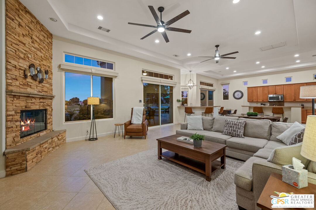 88 Vía Las Flores Rancho Mirage, CA 92270 - Photo 12 of 65 a living room with furniture and a fireplace