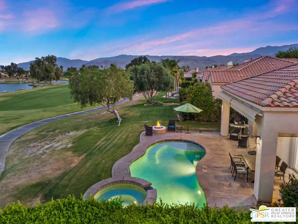 88 Vía Las Flores Rancho Mirage, CA 92270 - Photo 13 of 65 a view of a swimming pool with a yard