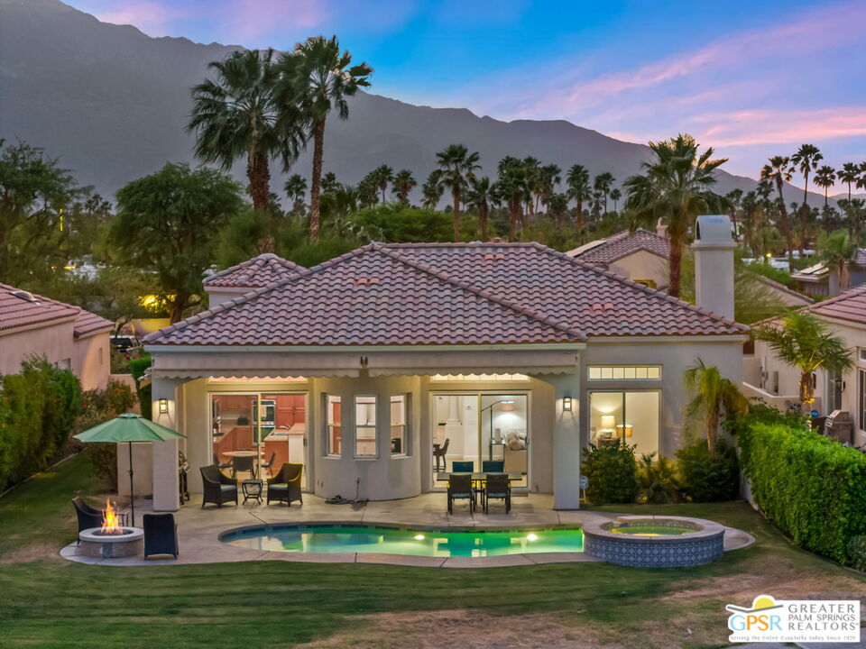 88 Vía Las Flores Rancho Mirage, CA 92270 - Photo 14 of 65 a front view of a house with swimming pool and garden