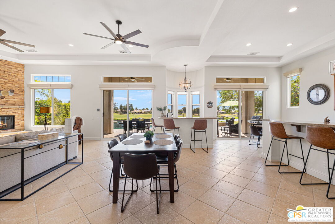 88 Vía Las Flores Rancho Mirage, CA 92270 - Photo 21 of 65 a living room with furniture a window and a ceiling fan