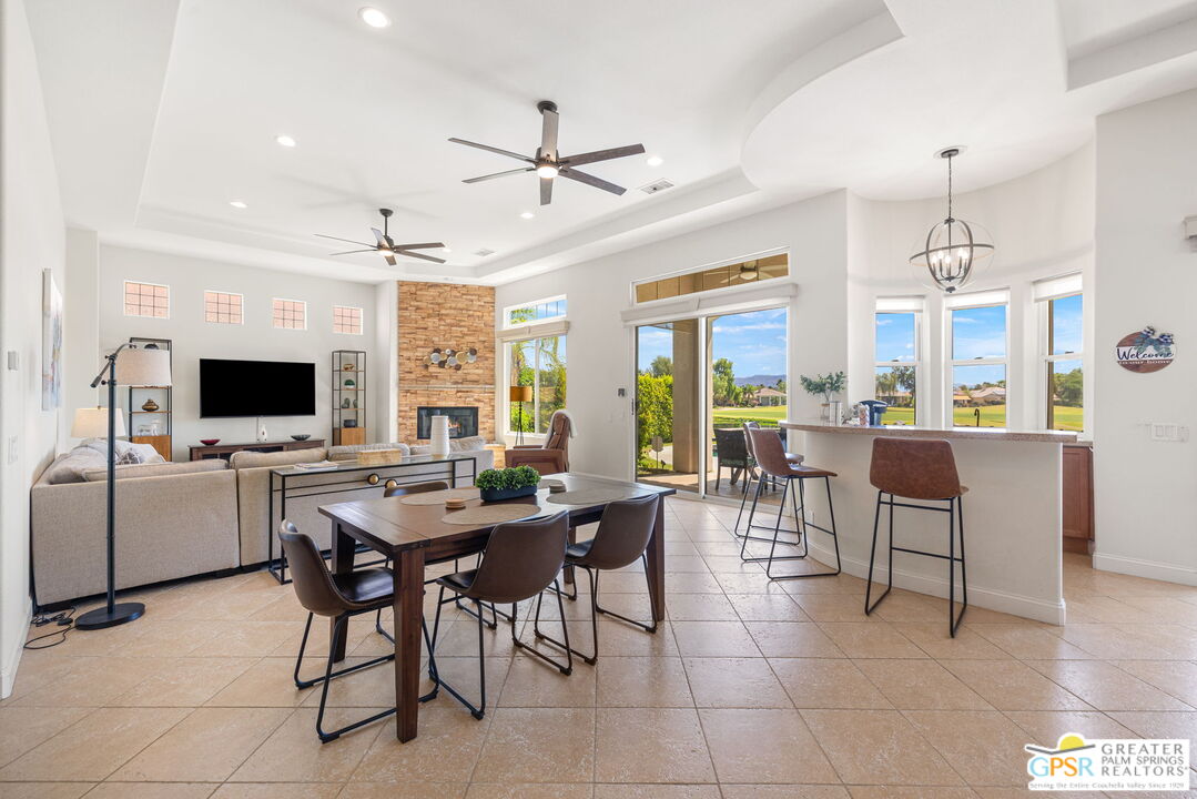 88 Vía Las Flores Rancho Mirage, CA 92270 - Photo 22 of 65 a view of a dining room with furniture window and wooden floor