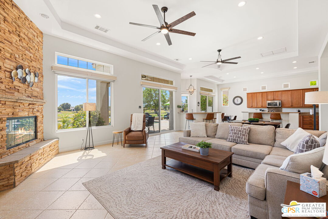 88 Vía Las Flores Rancho Mirage, CA 92270 - Photo 25 of 65 a living room with furniture ceiling fan and a rug