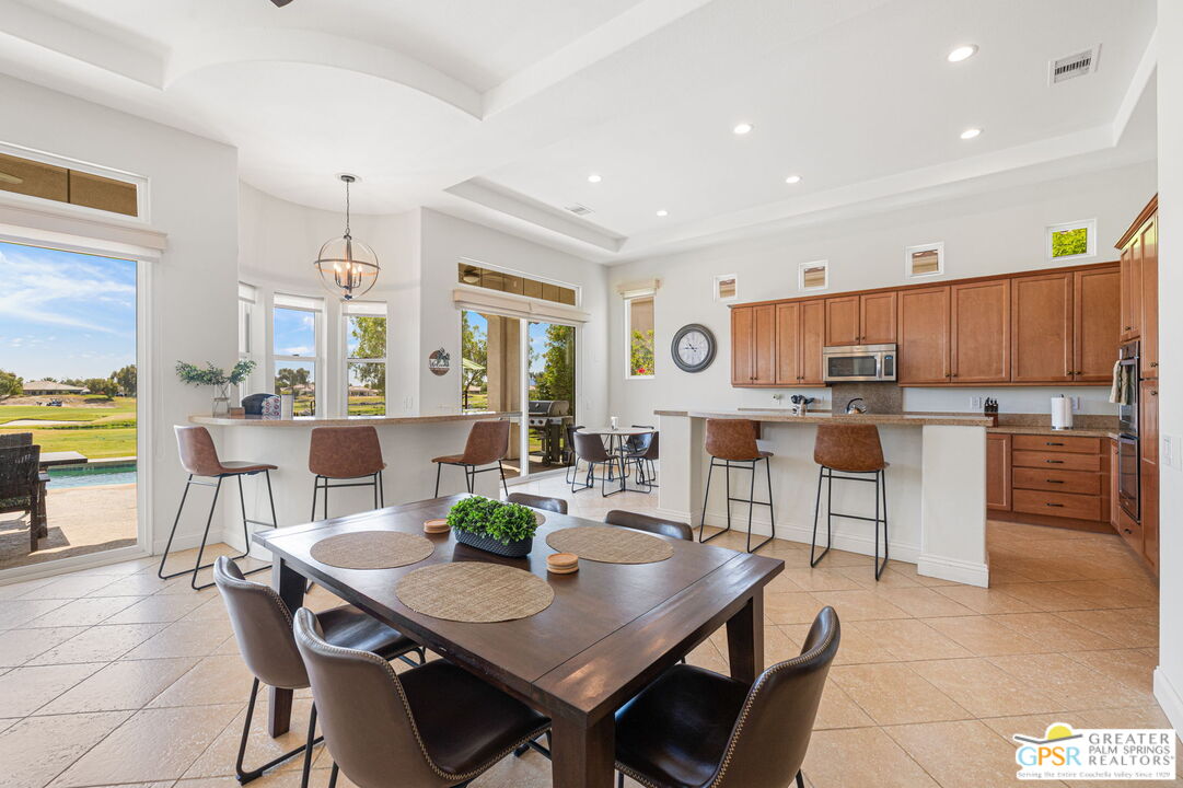 88 Vía Las Flores Rancho Mirage, CA 92270 - Photo 26 of 65 a view of a dining room with furniture