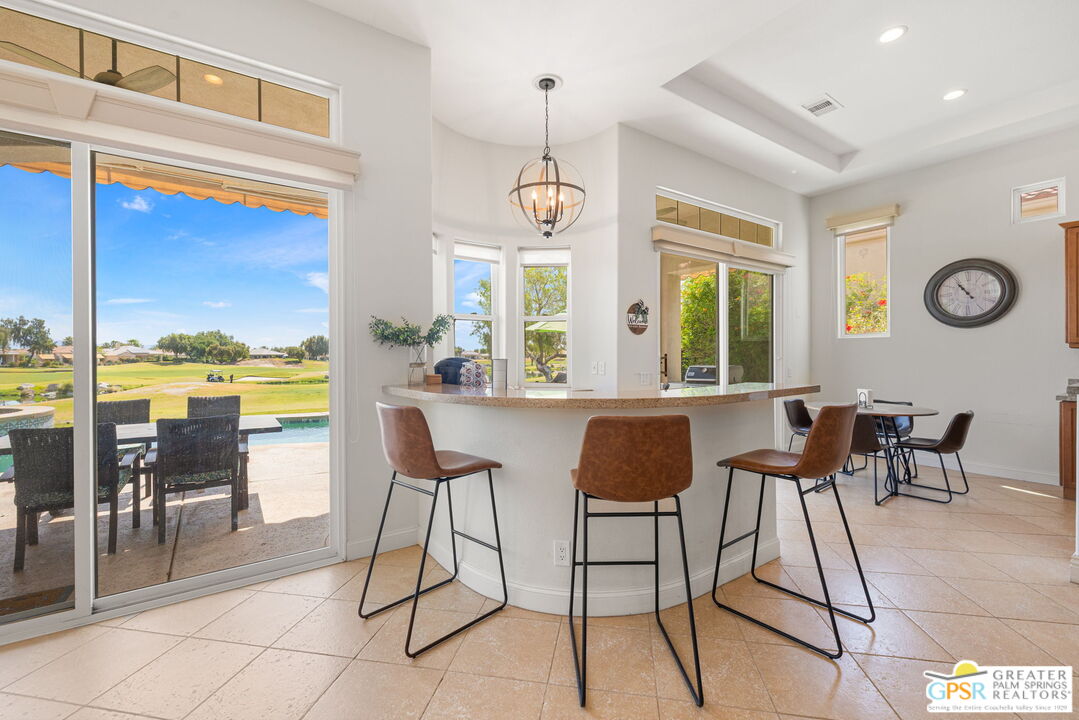 88 Vía Las Flores Rancho Mirage, CA 92270 - Photo 27 of 65 a view of a dining room with furniture window and outside view