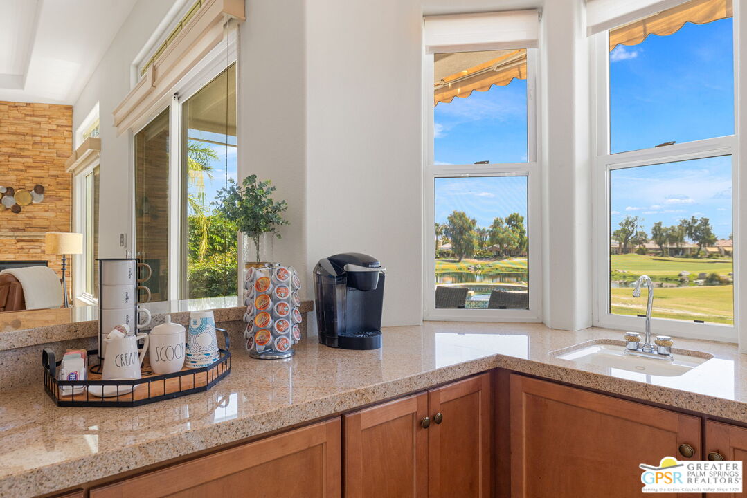 88 Vía Las Flores Rancho Mirage, CA 92270 - Photo 28 of 65 a kitchen with a large window and sink