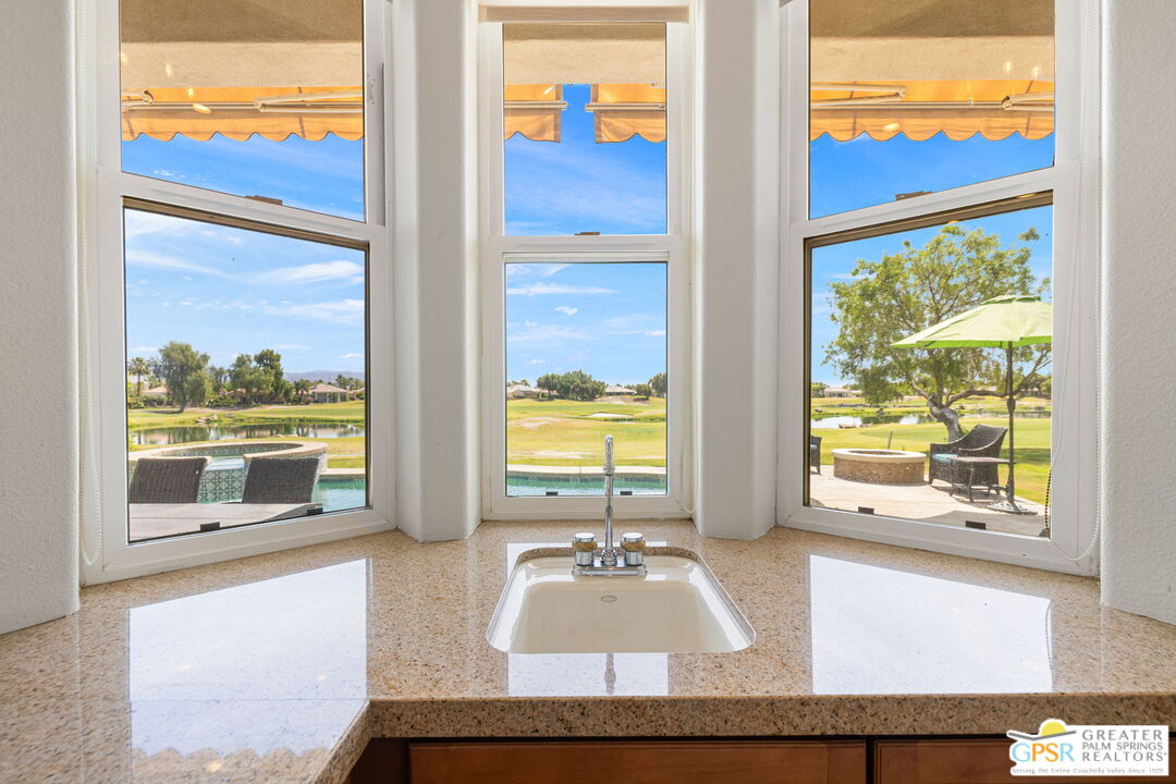 88 Vía Las Flores Rancho Mirage, CA 92270 - Photo 29 of 65 a living room view with a large window and pool table