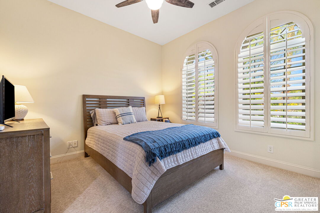 88 Vía Las Flores Rancho Mirage, CA 92270 - Photo 42 of 65 a spacious bedroom with a bed and a tv