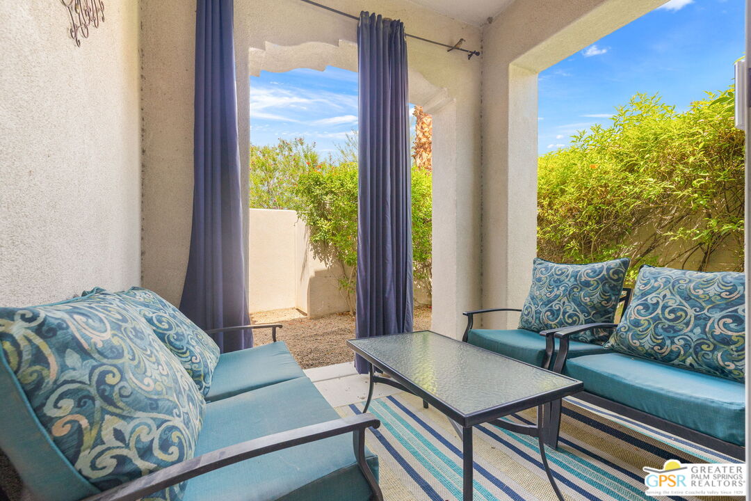 88 Vía Las Flores Rancho Mirage, CA 92270 - Photo 49 of 65 a living room with furniture and a large window