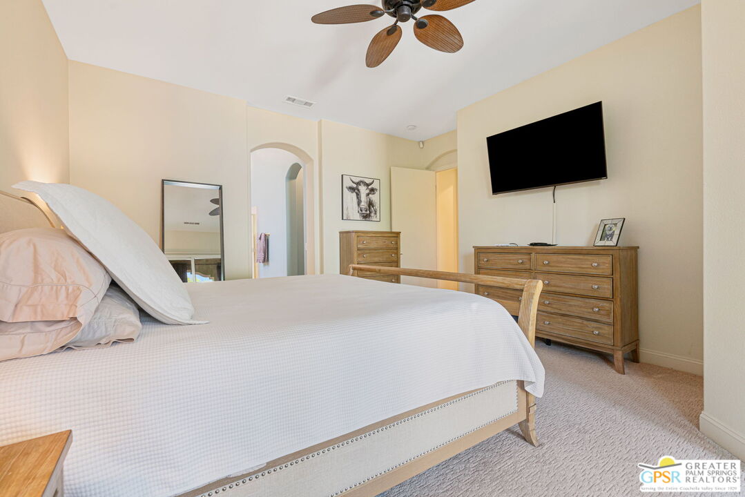 88 Vía Las Flores Rancho Mirage, CA 92270 - Photo 50 of 65 a bedroom with a bed and a flat tv screen on dresser