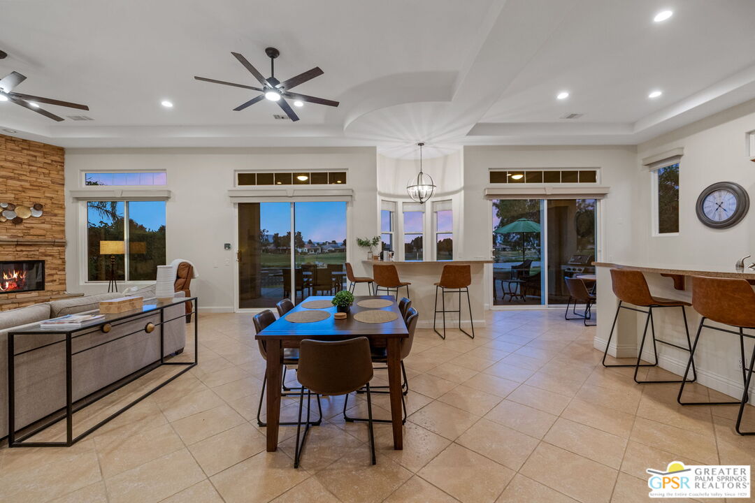 88 Vía Las Flores Rancho Mirage, CA 92270 - Photo 5 of 65 a living room with furniture a clock and a window