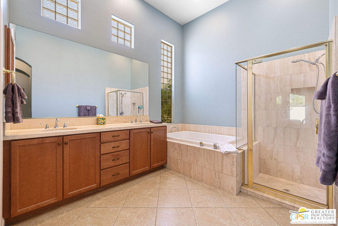 88 Vía Las Flores Rancho Mirage, CA 92270 - Photo 51 of 65 a spacious bathroom with a tub sink and mirror