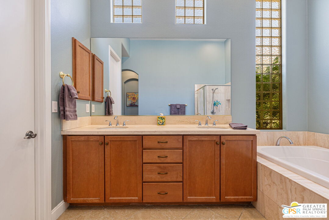 88 Vía Las Flores Rancho Mirage, CA 92270 - Photo 52 of 65 a bathroom with a sink double vanity and a mirror